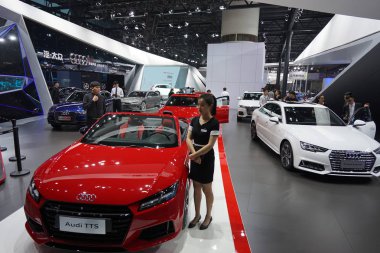 An Audi TTS and other Audi cars are on display during the 14th China (Guangzhou) International Automobile Exhibition, also known as Auto Guangzhou 2016, in Guangzhou city, south China's Guangdong province, 18 November 2016 clipart
