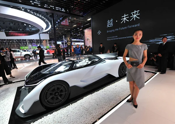 stock image Visitors look at a Faraday Future FF ZERO1 electric concept car on display during the 14th Beijing International Automotive Exhibition, also known as Auto China 2016, in Beijing, China, 27 April 2016