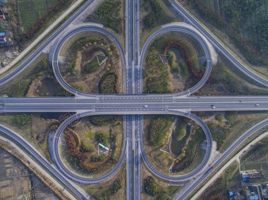 An aerial view of a cloverleaf overpass of National Highways 204 and 328 in Haian county, Nantong city, east China's Jiangsu province, 18 December 2016 clipart