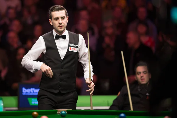 stock image Mark Selby of England, front, considers a shot against compatriot Ronnie O'Sullivan in their final match during the Betway UK Championship 2016 in York, UK, 4 December 2016