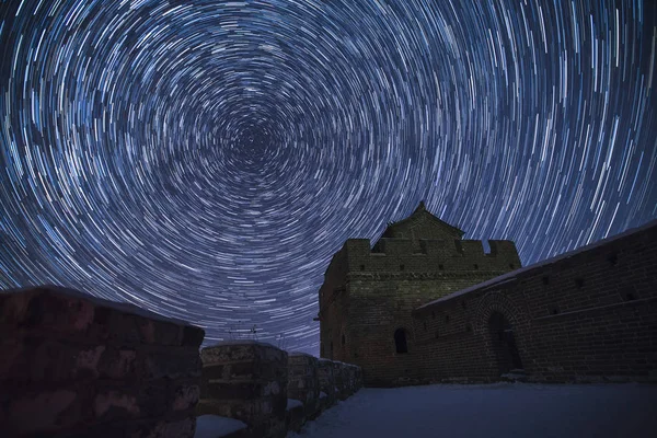 Landscape of the Jinshanling Great Wall in the snow below the starry sky in Luanping county, Chengde city, north China\'s Hebei province, 23 November 2016