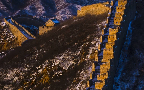 Landscape of the Jinshanling Great Wall in the snow at sunset in Luanping county, Chengde city, north China's Hebei province, 23 November 2016