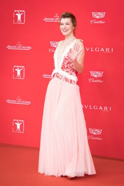 American actress Milla Jovovich arrives on the red carpet for the closing ceremony of the 20th Shanghai International Film Festival in Shanghai, China, 25 June 2017. clipart