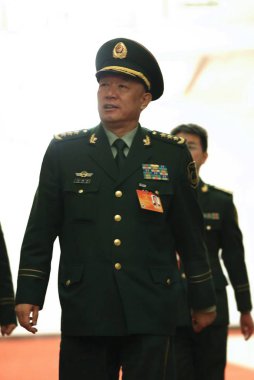 Wang Jianping, then commander of paramilitary forces of China, is pictured as he arrives at the closing meeting of the Second Session of the 12th NPC (National People's Congress) at the Great Hall of the People in Beijing, China, 13 March 201 clipart