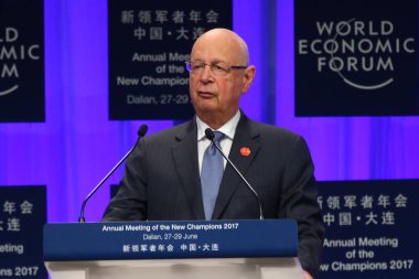 Klaus Schwab, Founder and Executive Chairman of the World Economic Forum, delivers a speech during the opening ceremony of the World Economic Forum Annual Meeting of the New Champions 2017, also known as the Summer Davos Forum 2017, in Dalian city, n clipart