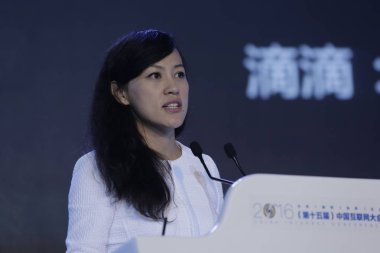 Liu Qing, President of taxi-hailing and car-service app Didi Chuxing and daughter of Lenovo founder Liu Chuanzhi, delivers a speech during the opening ceremony of the 2016 China Internet Conference (CIC) in Beijing, China, 21 June 2016 clipart