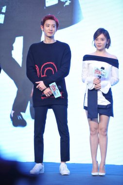 South Korean singer and actor Park Chan-yeol of South Korean-Chinese boy group EXO, left, and Chinese actress Yuan Shanshan attend a press conference to promote their new movie 