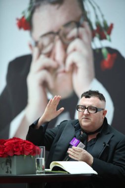 Alber Elbaz, former fashion designer of Paris fashion house Lanvin, attends a dialogue with Chinese fashion journalist Angelica Cheung, editor-in-chief of Vogue China, at Tsinghua University in Beijing, China, 31 March 2016. clipart