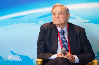 Billionaire investor George Soros, chairman of Soros Fund Management and founder of The Open Society Institute, attends a sub-forum during the Boao Forum for Asia Annual Conference 2013 in Qionghai city, south China's Hainan province, 8 April clipart