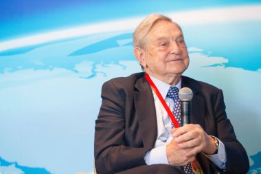 Billionaire investor George Soros, chairman of Soros Fund Management and founder of The Open Society Institute, attends a sub-forum during the Boao Forum for Asia Annual Conference 2013 in Qionghai city, south China's Hainan province, 8 April clipart