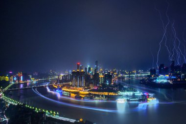 Night view of Yuzhong Peninsula with skyscrapers and high-rise buildings in Jiefangbei CBD, also known as Jiefangbei Commercial Walking Street, in Chongqing, China, 7 August 2014 clipart