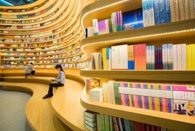 Customers visit a new bookstore in Hohhot city, north China's Inner Mongolia Autonomous Region, 17 January 2019 clipart