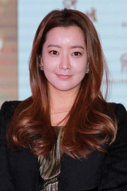 South Korean actress Kim Hee-sun smiles during a promotional event for a skincare product in Tianjin, China, 8 January 2016. clipart