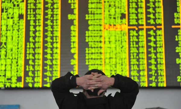 Concerned Chinese Investor Looks Prices Shares Green Price Falling Stock — Stock Photo, Image