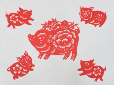 Chinese folk artist Li Yinjie shows paper-cutting artworks featuring pig to mark the upcoming Spring Festival or the Chinese New Year (Year of the Pig) in Jifeng town, Jishan county, Yuncheng city, north China's Shanxi province, 23 January 2019 clipart
