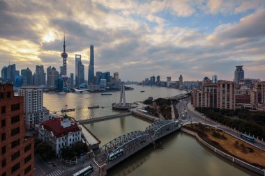 Skyline of Puxi with the Waibaidu Bridge, Huangpu River and the Lujiazui Financial District with the Oriental Pearl TV Tower, tallest, the Shanghai World Financial Center, third tallest, the Jinmao Tower, fourth tallest, the Shanghai Tower, second ta clipart