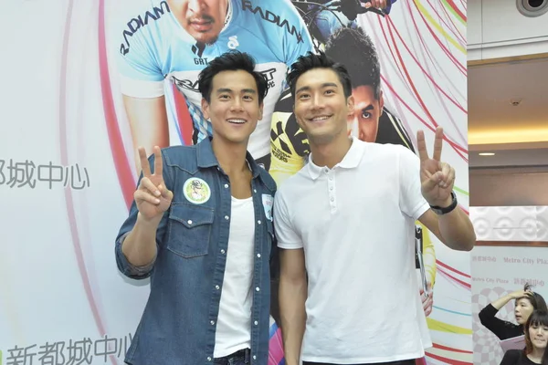 Stock image South Korean actor Choi Si-won, right, and Taiwanese actor Eddie Peng pose during a promotional event for their movie 