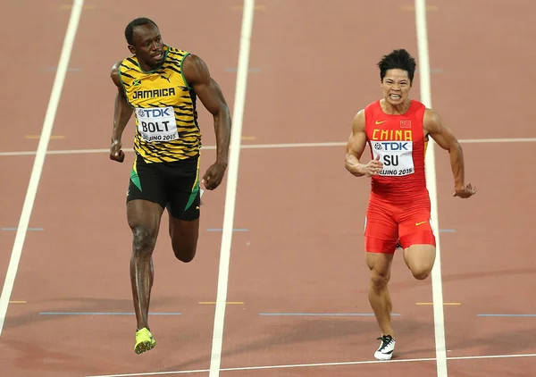 우사인 볼트의 자메이카 그리고 중국의 Bingtian는 베이징 2015 선수권 경기장 — 스톡 사진