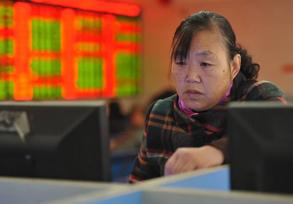 Concerned Chinese Investor Looks Prices Shares Red Price Rising Green — Stock Photo, Image