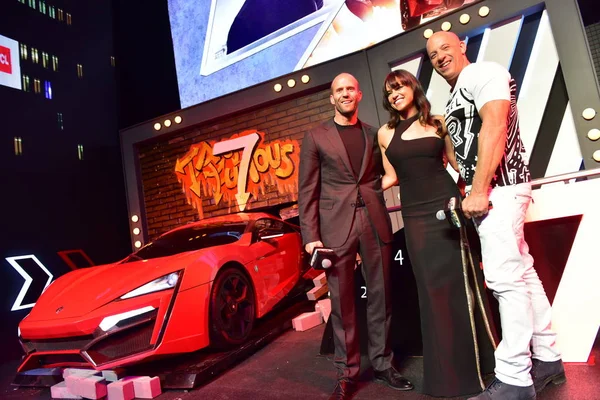 (From left) English actor Jason Statham, American actress Michelle Rodriguez and actor Vin Diesel attend a premiere event for their movie "Furious 7" in Beijing, China, 26 March 2015. — Stock Image Left English Actor Jason Statham American Actress Michelle Rodriguez Actor Royalty Free Stock Photos