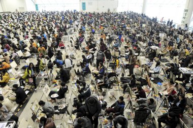 Chinese candidates are drawing as they take part in the entrance examination for art academies in Shandong University of Art & Design at Ji'nan Shungeng International Convention and Exhibition Center in Ji'nan city, east China's Shandong province, 27 clipart