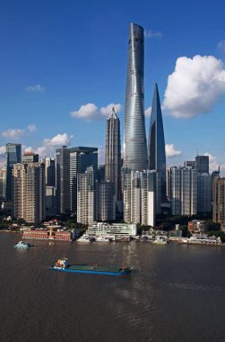 View of Huangpu River and the Lujiazui Financial District with the Shanghai Tower, tallest, the Shanghai World Financial Center, right tallest, the Jinmao Tower, left tallest, and other skyscrapers and high-rise buildings in Pudong, Shanghai, China,  clipart