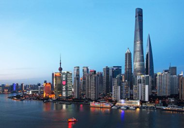 View of the Shanghai Tower, tallest, the Shanghai World Financial Center, second tallest, Jinmao Tower, third tallest, and other skyscrapers and high-rise buildings along the Huangpu River in the Lujiazui Financial District in Pudong, Shanghai, China clipart