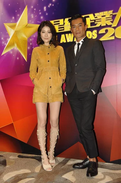 stock image Hong Kong actress Kelly Chen, left, and actor Louis Koo pose during the 2014 Elite Awards ceremony in Hong Kong, China, 11 March 2015. 