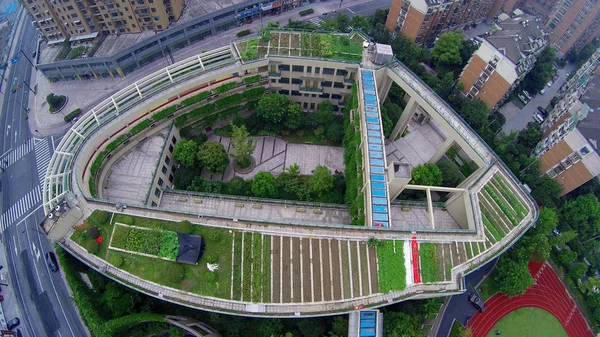 Aerial view of a garden on the rooftop of a building at an elementary school in Hangzhou city, east China\'s Zhejiang province, 13 August 2015