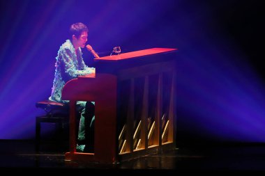 Taiwanese singer Jam Hsiao performs during his 2015 world tour concert in Hong Kong, China, 8 August 2015. clipart