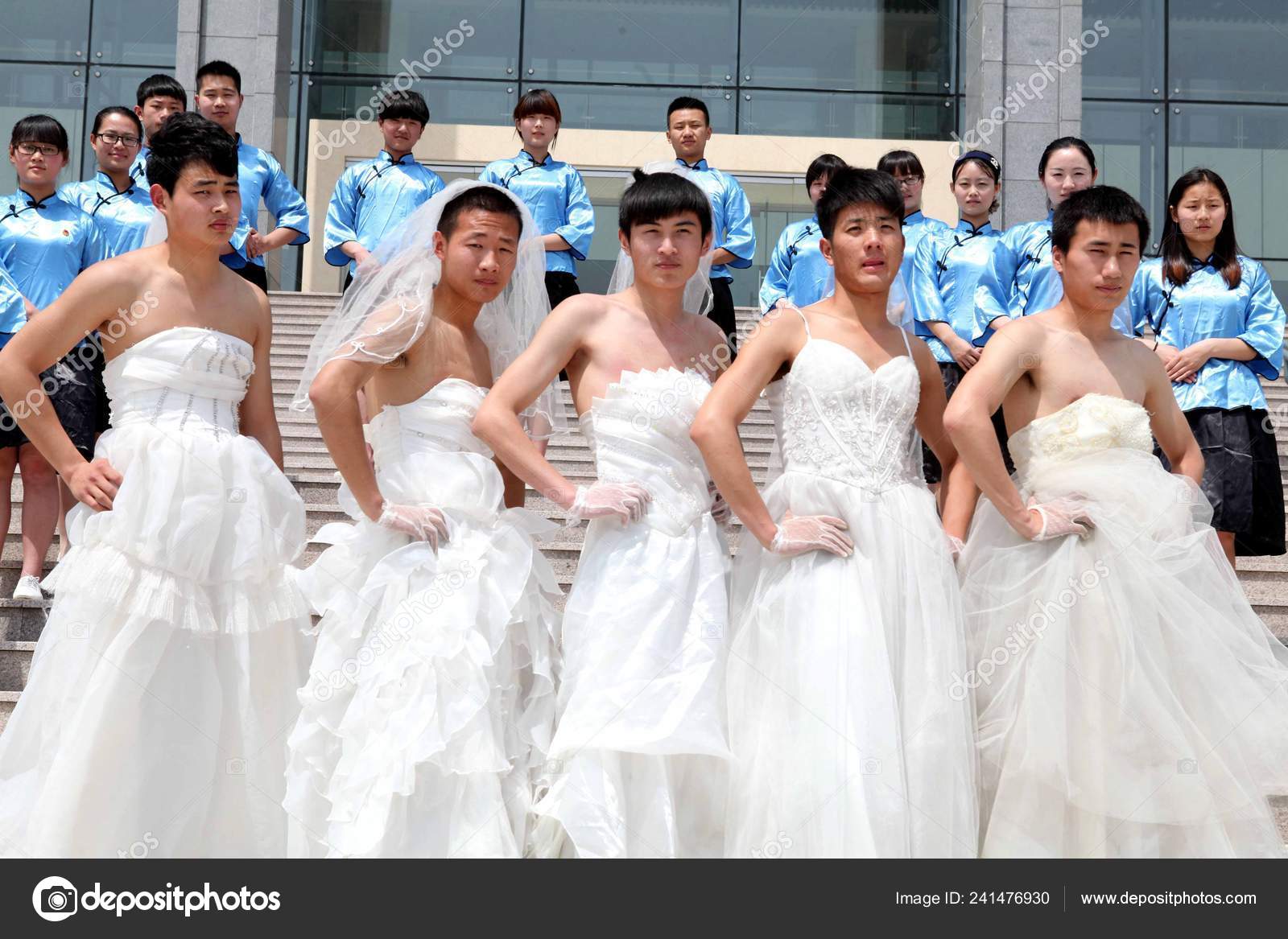 men wearing wedding dresses