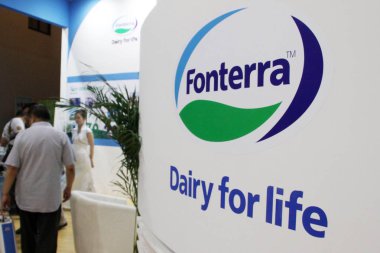 -People visit the stand of Fonterra Cooperative Group Ltd during a dairy products exhibition in Beijing, China, 12 September 2013 clipart