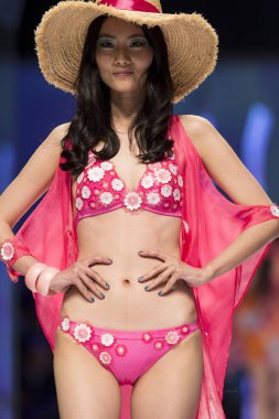 A model displays a new creation at the fashion show of lingerie brand Aimer during the Shanghai Fashion Week Fall/Winter 2014 in Shanghai, China, 9 April 2014. clipart