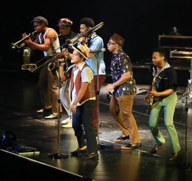 American singer Peter Gene Hernandez, front, known by his stage name Bruno Mars, performs with other entertainers during his Moonshine Jungle concert at Mercedes-Benz Arena in Shanghai, China, 3 April 2014.