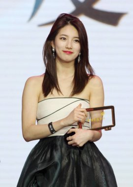 Suzy Bae Su-ji of South Korean girl group miss A poses after receiving Weibo Goddess of the Year award at the presentation ceremony of the 2014 Sina Weibo Night in Beijing, China, 15 January 2015. clipart