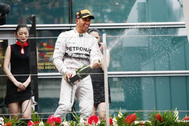 British F1 driver Lewis Hamilton of Mercedes AMG Petronas F1 Team sprays champagne to celebrate during the award presentation ceremony of the 2014 Formula 1 Chinese Grand Prix at the Shanghai International Circuit in Shanghai, China, 20 April 2014. clipart