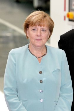 German Chancellor Angela Merkel visits the auto plant of FAW-Volkswagen in Chengdu city, southwest Chinas Sichuan province, 6 July 2014 clipart