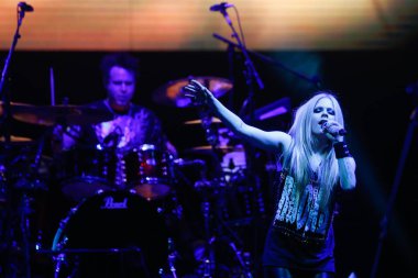 Canadian singer Avril Lavigne, right, performs during her China Tour concert in Shanghai, China, 21 February 2014.