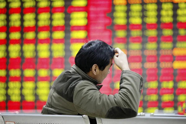 Concerned Chinese Investor Looks Prices Shares Red Price Rising Green — Stock Photo, Image