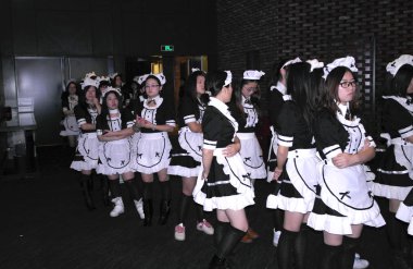 Chinese females dressed up as French maids to attend an attempt of Guinness record-breaking biggest French maid gathering held by 17173 Game in Shanghai World Financial Center in Shanghai, China, 19 January 2013 clipart