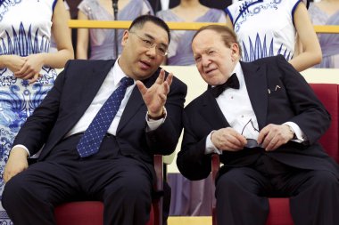 Sheldon Adelson (front right ), CEO of Sands China Ltd., listens to Chui Sai-on (front left), chief executive of Macau, during the opening ceremony of Sands Cotai Central in Macau, China, 11 April 2012 clipart