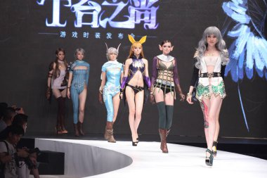 Models display new creations at the TERA game costume fashion show in Beijing, China, 9 July 2014. clipart