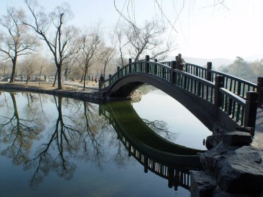 View of a bridge on a lake at the Chengde Mountain Resort in Chengde city, north Chinas Hebei province, 11 November 2005. clipart