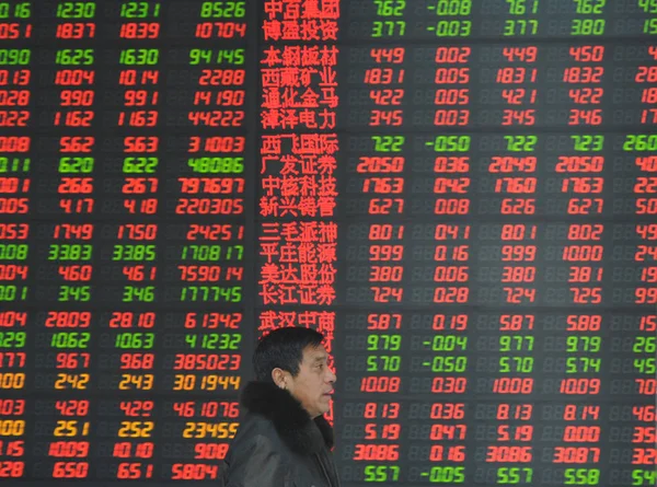 Chinese Investor Looks Share Prices Red Price Rising Stock Brokerage — Stock Photo, Image