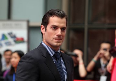 British actor Henry Cavill arrives at a press conference of the movie, Man of Steel, during the 16th Shanghai International Film Festival in Shanghai, China, 19 June 2013 clipart