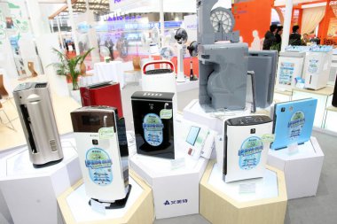 Airmate air purifiers are displayed during the Appliance World Expo (AWE) 2014 in Shanghai, China, 23 March 2014 clipart