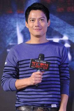 American actor Archie Kao, the husband of Chinese actress Zhou Xun, poses during a press conference for his new movie, The Deathday Party, in Beijing, China, 25 August 2014. clipart