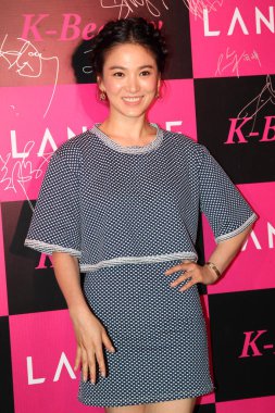 South Korean actress Song Hye-kyo poses as she arrives for a Laneige fashion event in Hong Kong, China, 2 July 2013. clipart