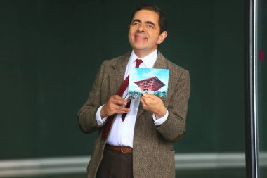 English actor Rowan Atkinson plays Mr. Bean during a filming session for a TV commercial at the Mercedes-Benz Arena in Shanghai, China, 20 August 2014. clipart