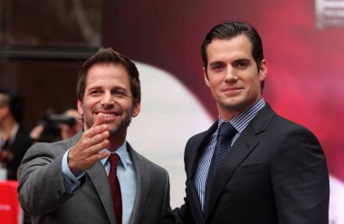 British actor Henry Cavill, right, and American director Zack Snyder, left, pose at a press conference of the new movie, Man of Steel, during the 16th Shanghai International Film Festival in Shanghai, China, 19 June 2013 clipart